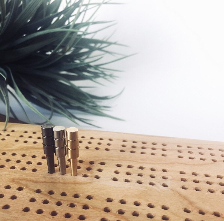 Metal cribbage pegs